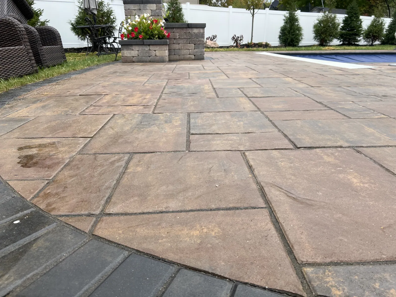 Sweeping Beacon Hill terrace with charcoal edge and river rock border