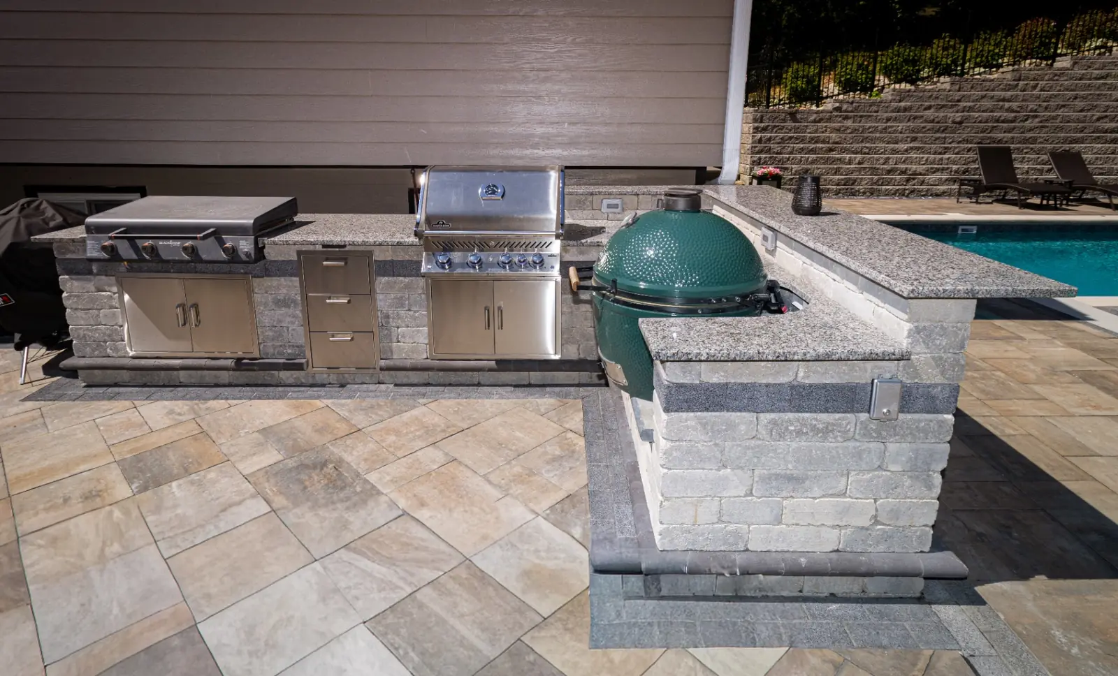 Granite outdoor kitchen with Blackstone griddle, Napoleon grill and Big Green Egg