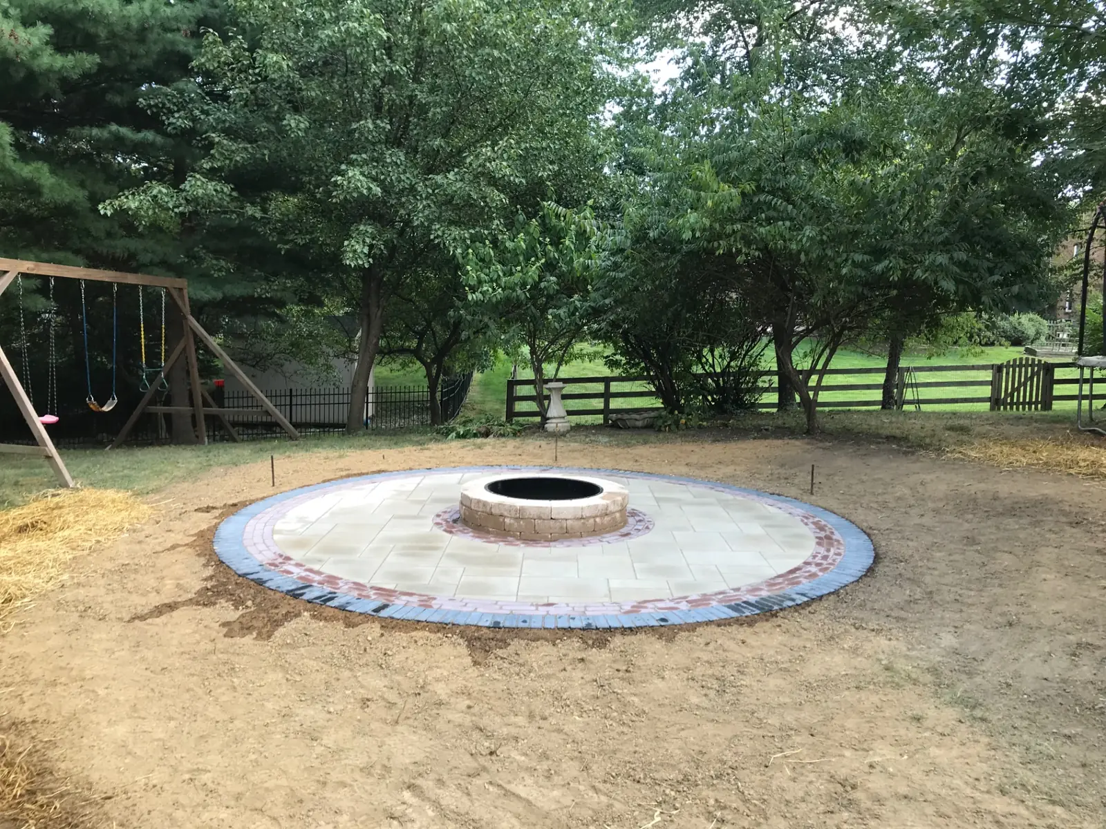 Custom fire feature integrated into a stone patio
