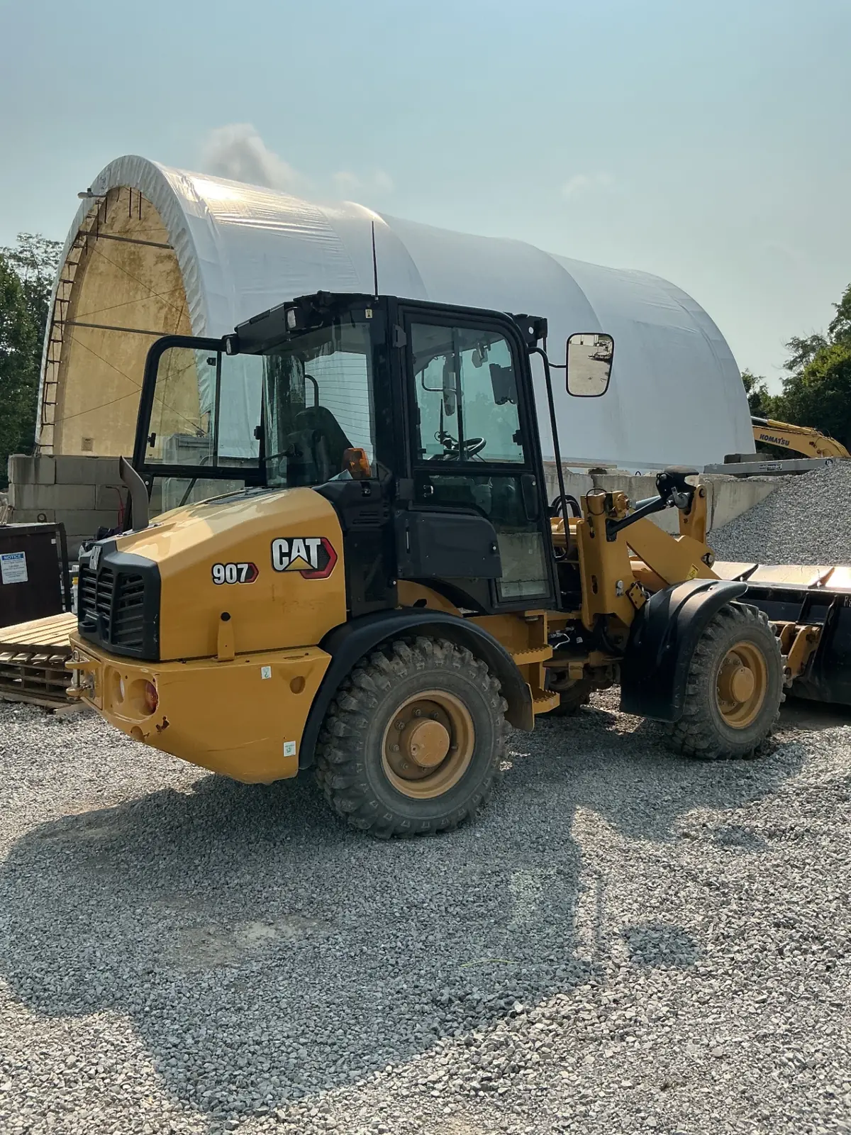 CAT 907 loader staged beside the bulk salt dome