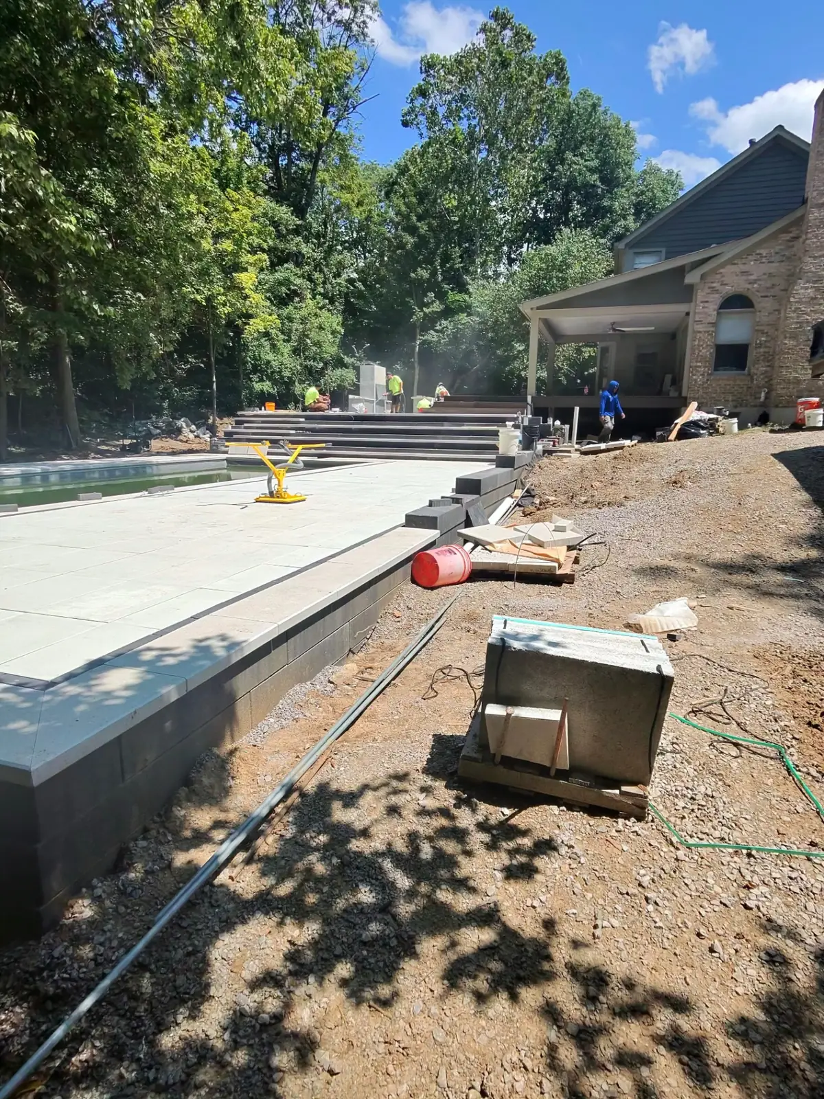 Precision pool deck construction underway on a TJs job site
